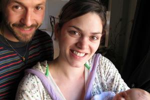 Brand new parents and baby in their first week together. Brand new parents and baby in their first week together.