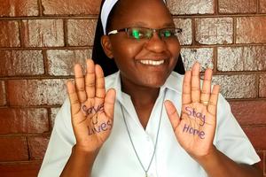 Above, Sister Astridah Banda displays one of the key COVID-19 messages.
Above, Sister Astridah Banda displays one of the key COVID-19 messages.