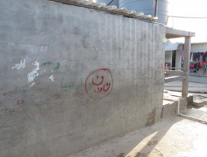 The "N" symbol on a house in Erbil, Iraq, in April 2016. The word "Nasrani" is the Arabic word for Christian and the "N" symbol has been used to mark the houses and property of Christians in Iraq. The "N" symbol on a house in Erbil, Iraq, in April 2016. The word "Nasrani" is the Arabic word for Christian and the "N" symbol has been used to mark the houses and property of Christians in Iraq.