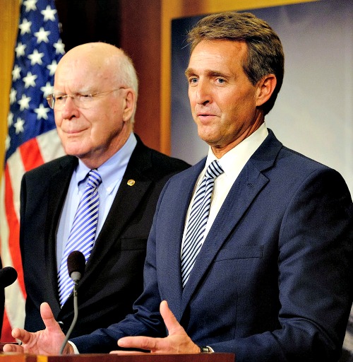 Sen. Jeff Flake (r), R-Ariz., with Sen. Patrick Leahy, D-Vt., discusses the efforts to retrieve U.S. contractor Alan Gross from prison in Cuba on Dec. 17 in Washington. Sen. Jeff Flake (r), R-Ariz., with Sen. Patrick Leahy, D-Vt., discusses the efforts to retrieve U.S. contractor Alan Gross from prison in Cuba on Dec. 17 in Washington.