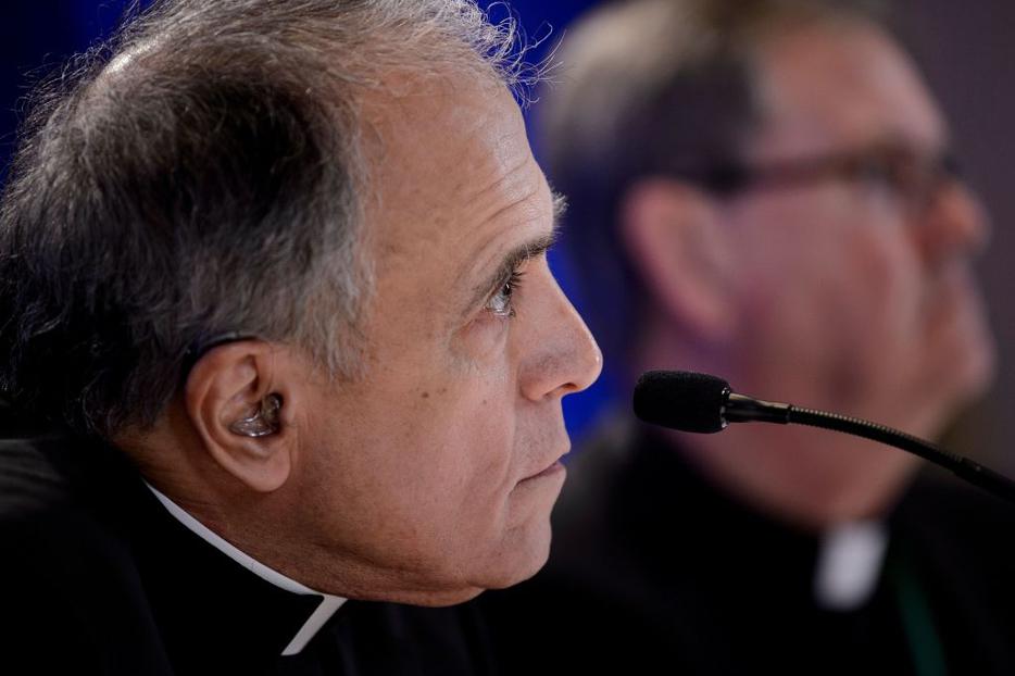 Galveston-Houston Cardinal Daniel DiNardo (l), president of the USCCB, and Indiana Bishop Timothy Doherty, chairman of the committee for the Protection of Children and Young People, listen during a press conference Nov. 12 in Baltimore, Maryland. Galveston-Houston Cardinal Daniel DiNardo (l), president of the USCCB, and Indiana Bishop Timothy Doherty, chairman of the committee for the Protection of Children and Young People, listen during a press conference Nov. 12 in Baltimore, Maryland.