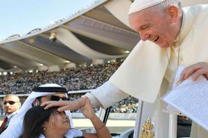 Pope Francis blesses a child at the Feb. 5 Mass in Abu Dhabi. Pope Francis blesses a child at the Feb. 5 Mass in Abu Dhabi.