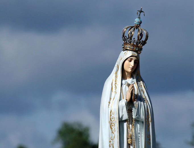 The statue of the Virgin Mary is carried in procession by the faithful prior to the start of a Mass at the Sanctuary of Our Lady of Fatima May 13, 2017, in Fatima, Portugal, to commemorate 100 years since the Marian apparitions began there. The statue of the Virgin Mary is carried in procession by the faithful prior to the start of a Mass at the Sanctuary of Our Lady of Fatima May 13, 2017, in Fatima, Portugal, to commemorate 100 years since the Marian apparitions began there.