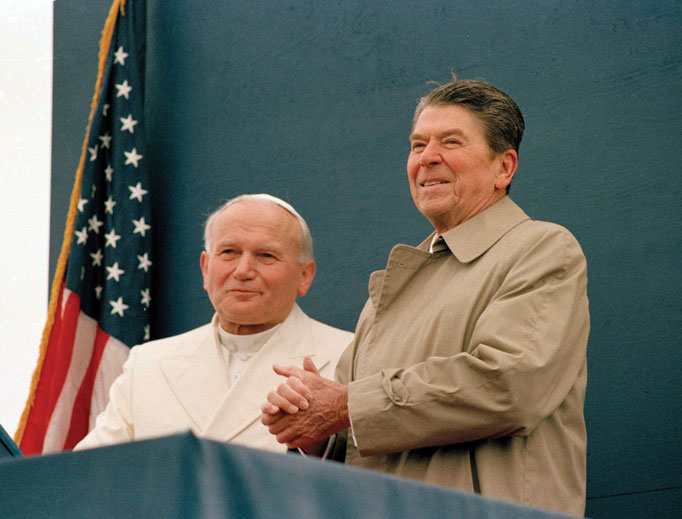 President Ronald Reagan smiles at the crowd as Pope John Paul II stands by his side during a joint appearance at the airport in Fairbanks, Alaska, May 2, 1984. President Ronald Reagan smiles at the crowd as Pope John Paul II stands by his side during a joint appearance at the airport in Fairbanks, Alaska, May 2, 1984.