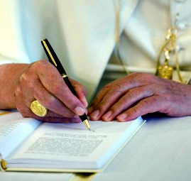 Pope Benedict XVI signs his third encyclical 'Caritas in Veritate.' Pope Benedict XVI signs his third encyclical 'Caritas in Veritate.'