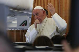 Pope Francis responds to journalists’ questions aboard the papal plane returning to Rome Nov. 1. Pope Francis responds to journalists’ questions aboard the papal plane returning to Rome Nov. 1.