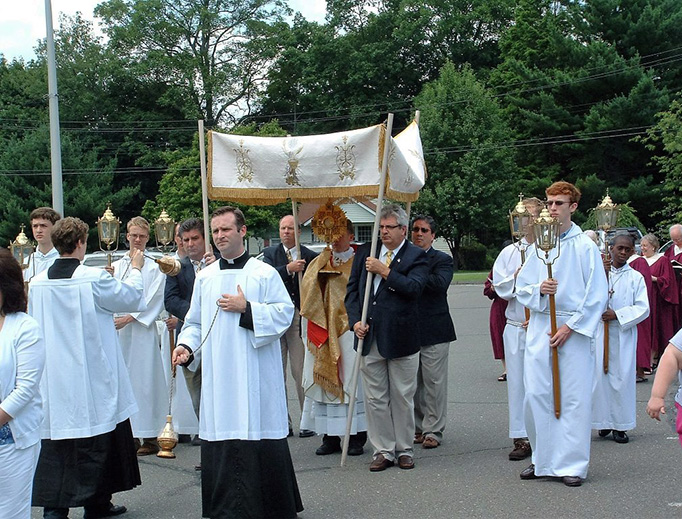 ABOVE: Fr. Brian Gannon carries the Blessed Sacrament in a procession to mark the Solemnity of Christ the King, escorted by the Sons of Saint Joseph. — BELOW: The Sons of Saint Joseph at St. Theresa Church in Trumbull, Connecticut. (Photos courtesy of Fr. Brian Gannon) ABOVE: Fr. Brian Gannon carries the Blessed Sacrament in a procession to mark the Solemnity of Christ the King, escorted by the Sons of Saint Joseph. — BELOW: The Sons of Saint Joseph at St. Theresa Church in Trumbull, Connecticut. (Photos courtesy of Fr. Brian Gannon)