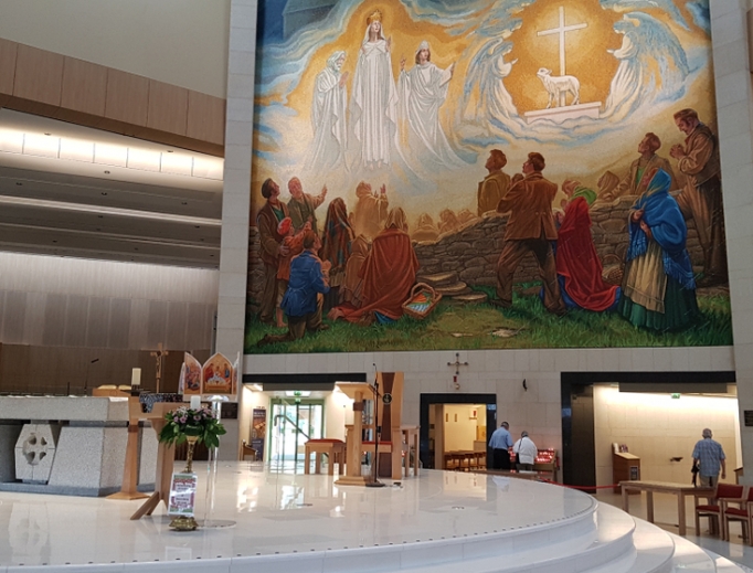 The 1879 apparition of the Virgin Mary, St. Joseph, St. John the Evangelist, angels and the Lamb of God is commemorated inside the Knock Shrine. The 1879 apparition of the Virgin Mary, St. Joseph, St. John the Evangelist, angels and the Lamb of God is commemorated inside the Knock Shrine.