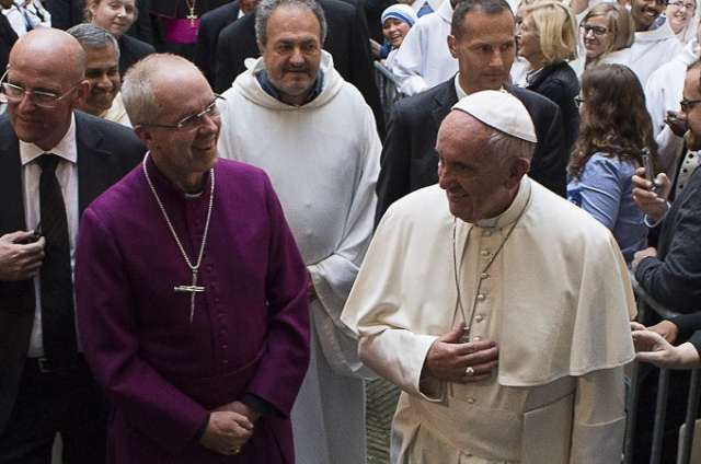 Pope Francis and Anglican Primate Archbishop Justin Welby walk into the Church of San Gregorio al Cielo to pray First Vepsers together. Pope Francis and Anglican Primate Archbishop Justin Welby walk into the Church of San Gregorio al Cielo to pray First Vepsers together.