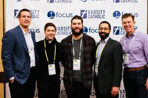 Above, l to r:Joe Reitz (former NFL player), Father Chase Hilgenbrinck (former MLS player), Trevor Williams (starting pitcher for the Pittsburgh Pirates), Thomas Wurtz of Varsity Catholic and Matt Birk (former NFL player) attend a Varsity Catholic event at the 'Seek' conference hosted by Fellowship of Catholic University Students. Below, Wurtz (l) and Lou Holtz (c) chat with Calvin Mueller (r) at 'Seek.' Above, l to r:Joe Reitz (former NFL player), Father Chase Hilgenbrinck (former MLS player), Trevor Williams (starting pitcher for the Pittsburgh Pirates), Thomas Wurtz of Varsity Catholic and Matt Birk (former NFL player) attend a Varsity Catholic event at the 'Seek' conference hosted by Fellowship of Catholic University Students. Below, Wurtz (l) and Lou Holtz (c) chat with Calvin Mueller (r) at 'Seek.'