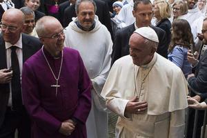 Pope Francis and Anglican Primate Archbishop Justin Welby walk into the Church of San Gregorio al Cielo to pray First Vepsers together. Pope Francis and Anglican Primate Archbishop Justin Welby walk into the Church of San Gregorio al Cielo to pray First Vepsers together.