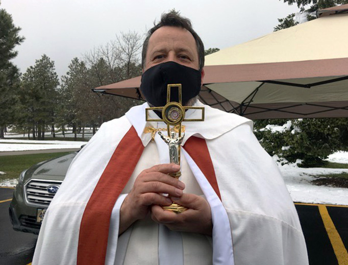 ABOVE AND 3RD INSET: Father Andrzej Wyrostek at Our Lady of the Black Hills in Piedmont, South Dakota, holds a “drive-through blessing” on Divine Mercy Sunday (Photos courtesy of Pamela Weaver). 1ST AND 2ND INSETS AND BOTTOM: St. Ann’s Catholic Church in Clayton, North Carolina, offers “Divine Mercy Drive-In Holy Hour” Sunday (Caitlin Rose Photography). ABOVE AND 3RD INSET: Father Andrzej Wyrostek at Our Lady of the Black Hills in Piedmont, South Dakota, holds a “drive-through blessing” on Divine Mercy Sunday (Photos courtesy of Pamela Weaver). 1ST AND 2ND INSETS AND BOTTOM: St. Ann’s Catholic Church in Clayton, North Carolina, offers “Divine Mercy Drive-In Holy Hour” Sunday (Caitlin Rose Photography).