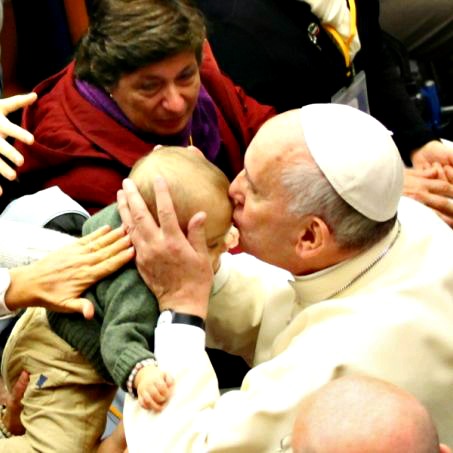 Pope Francis kisses a baby at a Pontifical Council for Health Care conference on autism Nov. 22. Pope Francis kisses a baby at a Pontifical Council for Health Care conference on autism Nov. 22.