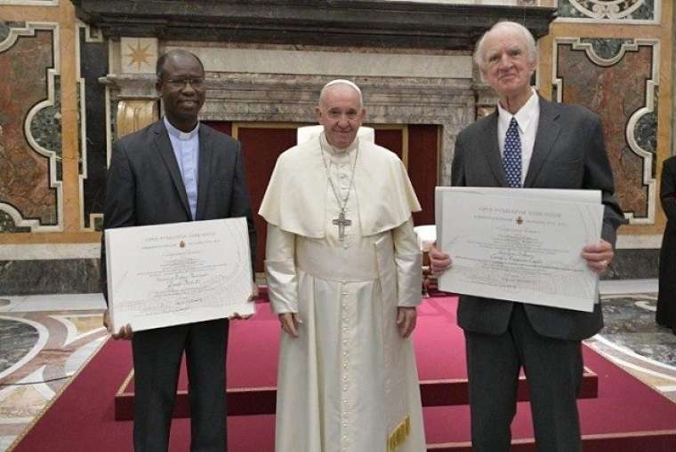 2019 Ratzinger Prize winners, Father Paul Béré.and Charles Taylor, pose with Pope Francis Nov. 9. 2019 Ratzinger Prize winners, Father Paul Béré.and Charles Taylor, pose with Pope Francis Nov. 9.