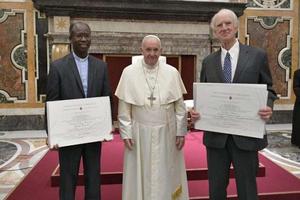 2019 Ratzinger Prize winners, Father Paul Béré.and Charles Taylor, pose with Pope Francis Nov. 9. 2019 Ratzinger Prize winners, Father Paul Béré.and Charles Taylor, pose with Pope Francis Nov. 9.