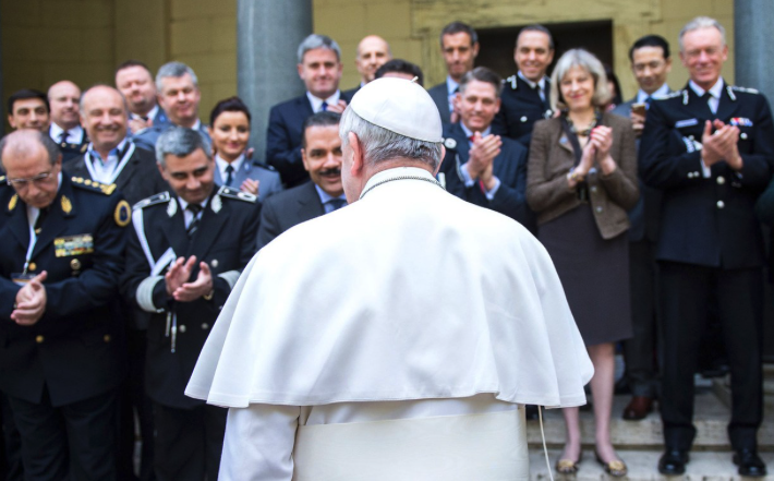 Pope Francis with police chiefs at a meeting of the Santa Marta Group which brings together bishops and police forces around the world to eradicate human trafficking and modern-day slavery. Pope Francis with police chiefs at a meeting of the Santa Marta Group which brings together bishops and police forces around the world to eradicate human trafficking and modern-day slavery.