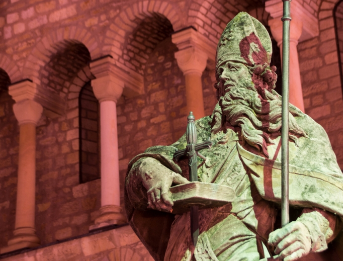 A statue of St. Boniface at St. Martin’s Cathedral in Mainz, Germany, is a tribute to the saint who brought Christianity to Germany. A statue of St. Boniface at St. Martin’s Cathedral in Mainz, Germany, is a tribute to the saint who brought Christianity to Germany.
