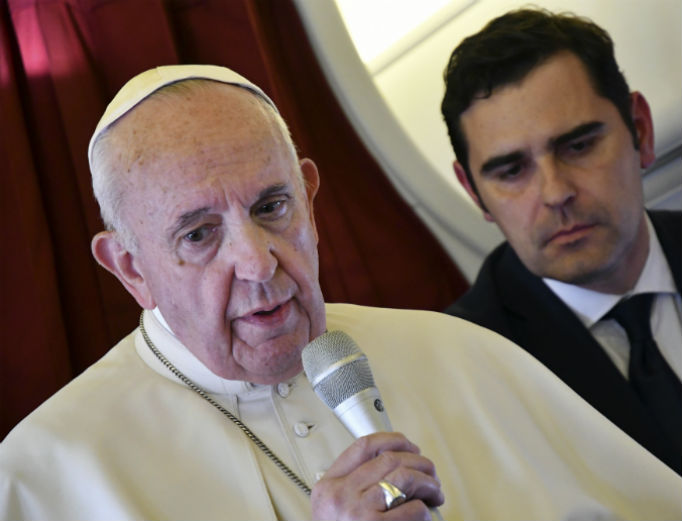 Pope Francis, flanked by interim director of Holy See Press Office, Alessandro Gisotti, speaks to reporters on board the flight back to Rome from a two-day trip to Morocco, March 31. Pope Francis, flanked by interim director of Holy See Press Office, Alessandro Gisotti, speaks to reporters on board the flight back to Rome from a two-day trip to Morocco, March 31.