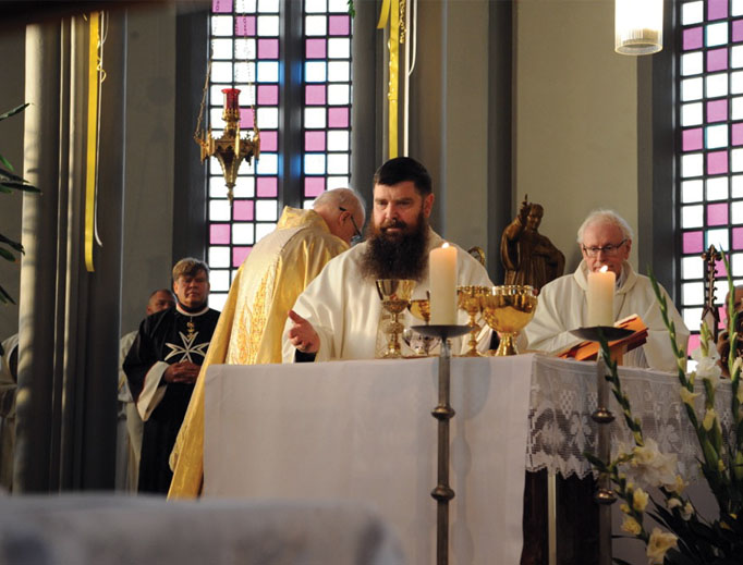 From top to bottom: Bishop Dávid Tencer of the Diocese of Reykjavik celebrates Mass at the Cathedral of Christ the King. At the rectory of Christ the King, Father Patrick Breen (l), John Aidan Byrne (c) and Deacon Michael Friggie (r) are all smiles. The diocesan pilgrimage to Mariulind on the west coast draws the faithful. Nuns at St. Thorlac Church in Reyðarfjörður are happy in their vocations and the lovely locale. And the cathedral draws worshippers, who number many immigrants and youth. From top to bottom: Bishop Dávid Tencer of the Diocese of Reykjavik celebrates Mass at the Cathedral of Christ the King. At the rectory of Christ the King, Father Patrick Breen (l), John Aidan Byrne (c) and Deacon Michael Friggie (r) are all smiles. The diocesan pilgrimage to Mariulind on the west coast draws the faithful. Nuns at St. Thorlac Church in Reyðarfjörður are happy in their vocations and the lovely locale. And the cathedral draws worshippers, who number many immigrants and youth.