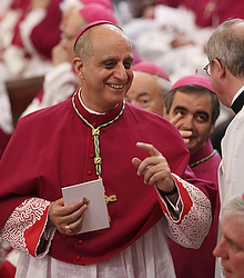 Archbishop Rino Fisichella, head of the new Pontifical Council for Promoting the New Evangelization, talks with a cleric before the start of an evening prayer service led by Pope Benedict XVI at the Basilica of St. Paul Outside the Walls in Rome June 28. At the service, the Pope announced he was establishing the new Pontifical Council. Archbishop Rino Fisichella, head of the new Pontifical Council for Promoting the New Evangelization, talks with a cleric before the start of an evening prayer service led by Pope Benedict XVI at the Basilica of St. Paul Outside the Walls in Rome June 28. At the service, the Pope announced he was establishing the new Pontifical Council.