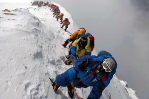 In this photo taken May 16, 2018, mountaineers ascend on their way to the summit of Mount Everest, as they climb on the south face from Nepal. In this photo taken May 16, 2018, mountaineers ascend on their way to the summit of Mount Everest, as they climb on the south face from Nepal.