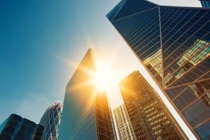 Sun hitting buildings in the business center of Paris. Sun hitting buildings in the business center of Paris.