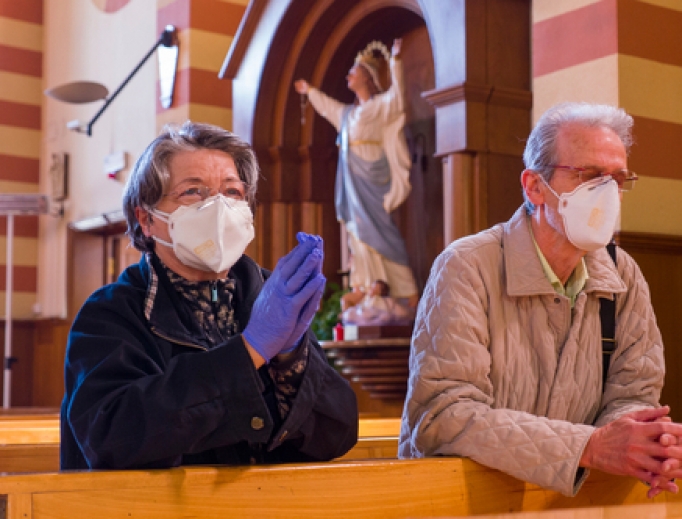 A couple prays in the church of San Giuseppe dei Falegnami in Rome during the coronavirus lockdown taking advantage of the few hours of opening of the church, April 11, 2020. A couple prays in the church of San Giuseppe dei Falegnami in Rome during the coronavirus lockdown taking advantage of the few hours of opening of the church, April 11, 2020.