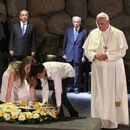 Two young students who live in Israel, Eva Kolodkina and Hoang Huy Nguyen, help Pope Francis lay a wreath May 26 at Israel’s Yad Vashem Holocaust Memorial. Two young students who live in Israel, Eva Kolodkina and Hoang Huy Nguyen, help Pope Francis lay a wreath May 26 at Israel’s Yad Vashem Holocaust Memorial.