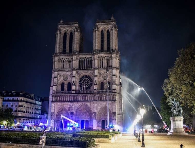 Firefighters respond to a major fire at Notre Dame cathedral in Paris, April 15, 2019. Firefighters respond to a major fire at Notre Dame cathedral in Paris, April 15, 2019.