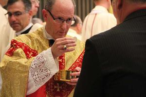 Bishop James Conley gives Communion at his 2012 installation Mass in Lincoln, Nebraska. Bishop James Conley gives Communion at his 2012 installation Mass in Lincoln, Nebraska.