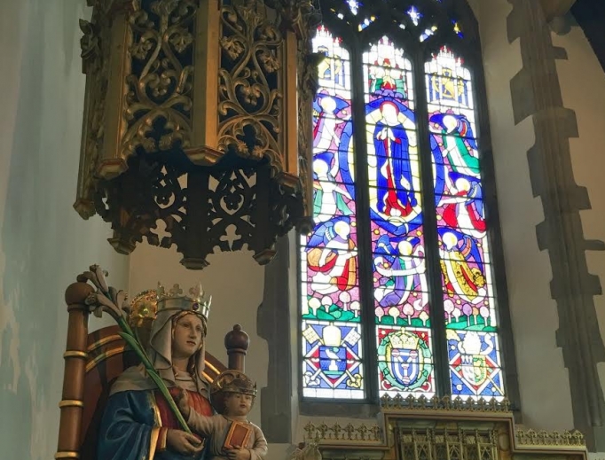 A statue of Our Lady of Walsingham in the national shrine of England. A statue of Our Lady of Walsingham in the national shrine of England.