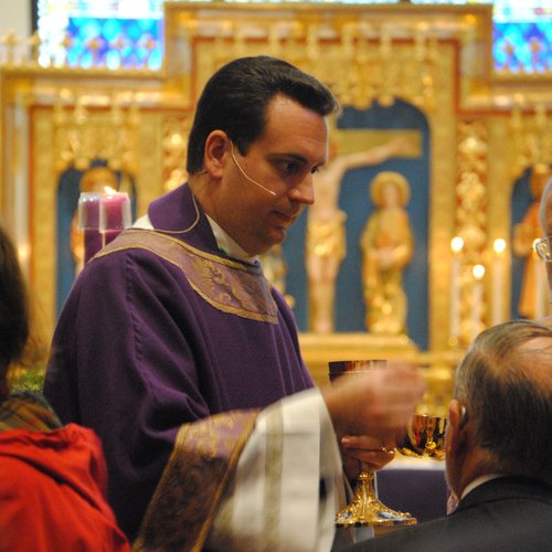 Bishop-elect Steven Lopes distributes Communion. Bishop-elect Steven Lopes distributes Communion.