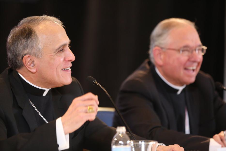 Cardinal Daniel DiNardo (l.) and Archbishop Jose Gomez, president and vice-president of the USCCB at the spring meeting in Indianapolis. Cardinal Daniel DiNardo (l.) and Archbishop Jose Gomez, president and vice-president of the USCCB at the spring meeting in Indianapolis.