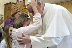 Holy Father shares a blessed moment with a young resident of St. Alessio-Margherita di Savoia Regional Center. Holy Father shares a blessed moment with a young resident of St. Alessio-Margherita di Savoia Regional Center.