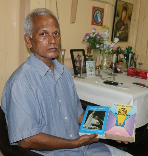Mathew Uzhunnalil, the oldest brother of kidnapped Salesian Father Thomas Uzhunnalil, sits with a prayer book on March 28 in the family’s ancestral home in Ramapuram, India. Mathew Uzhunnalil, the oldest brother of kidnapped Salesian Father Thomas Uzhunnalil, sits with a prayer book on March 28 in the family’s ancestral home in Ramapuram, India.