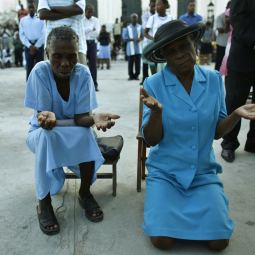 People pray during Mass outside the cathedral in Port-au-Prince, Haiti, Oct. 31, the eve of the feast of All Saints. Like many of the buildings in the capital, the cathedral was reduced to rubble in the devastating Jan. 12 earthquake. People pray during Mass outside the cathedral in Port-au-Prince, Haiti, Oct. 31, the eve of the feast of All Saints. Like many of the buildings in the capital, the cathedral was reduced to rubble in the devastating Jan. 12 earthquake.