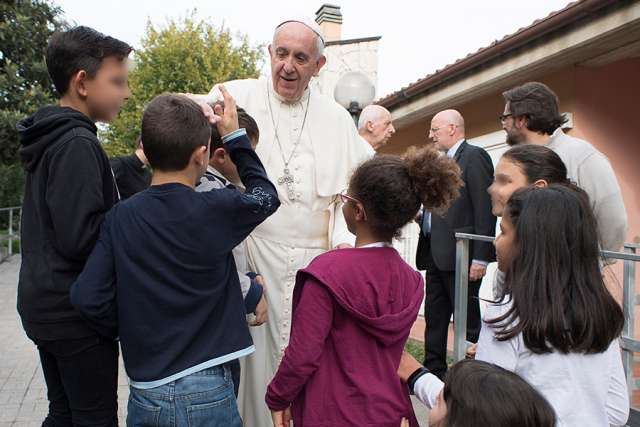 Pope Francis visits children at the SOS Village in Rome Oct. 14. Pope Francis visits children at the SOS Village in Rome Oct. 14.