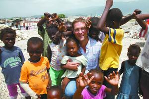 Mary’s Meals assists children from Haiti (shown above with founder Magnus MacFarlane) and across the globe. Below, MacFarlane greets children eating a meal provided by Mary’s Meals in Malawi. Mary’s Meals assists children from Haiti (shown above with founder Magnus MacFarlane) and across the globe. Below, MacFarlane greets children eating a meal provided by Mary’s Meals in Malawi.
