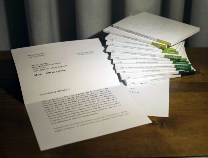 A letter by retired Pope Benedict is seen in this photo, released March 13, that the Vatican admitted
was doctored, by blurring its final two lines, where retired Pope Benedict begins to acknowledge that he
didn’t read an 11-volume set of books about Pope Francis’ theology, seen at right, and doesn’t have time to comment
on them. The Vatican announced March 21 that the head of the Vatican’s communications department,
Msgr. Dario Viganò, had resigned over a scandal about the letter, indicating that he mischaracterized it in public
and then digitally manipulated it in the photograph sent to the media. A letter by retired Pope Benedict is seen in this photo, released March 13, that the Vatican admitted
was doctored, by blurring its final two lines, where retired Pope Benedict begins to acknowledge that he
didn’t read an 11-volume set of books about Pope Francis’ theology, seen at right, and doesn’t have time to comment
on them. The Vatican announced March 21 that the head of the Vatican’s communications department,
Msgr. Dario Viganò, had resigned over a scandal about the letter, indicating that he mischaracterized it in public
and then digitally manipulated it in the photograph sent to the media.