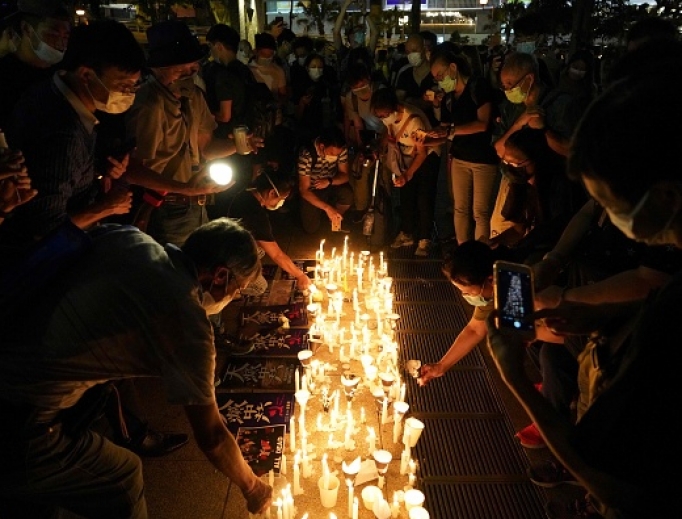 People light candles as they attend a vigil in Victoria Park in Hong Kong on June 4, 2020, after the annual remembrance that traditionally takes place in the park to mark the 1989 Tiananmen Square crackdown was banned on public health grounds because of the coronavirus pandemic. People light candles as they attend a vigil in Victoria Park in Hong Kong on June 4, 2020, after the annual remembrance that traditionally takes place in the park to mark the 1989 Tiananmen Square crackdown was banned on public health grounds because of the coronavirus pandemic.