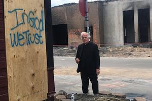 Above, Dominican Father Joseph Gillespie, the pastor of St. Albert the Great in south Minneapolis, stands by a hopeful message amid destruction in his parish neighborhood. The area was looted during violent protests following the death of George Floyd at the end of May. Above, Dominican Father Joseph Gillespie, the pastor of St. Albert the Great in south Minneapolis, stands by a hopeful message amid destruction in his parish neighborhood. The area was looted during violent protests following the death of George Floyd at the end of May.