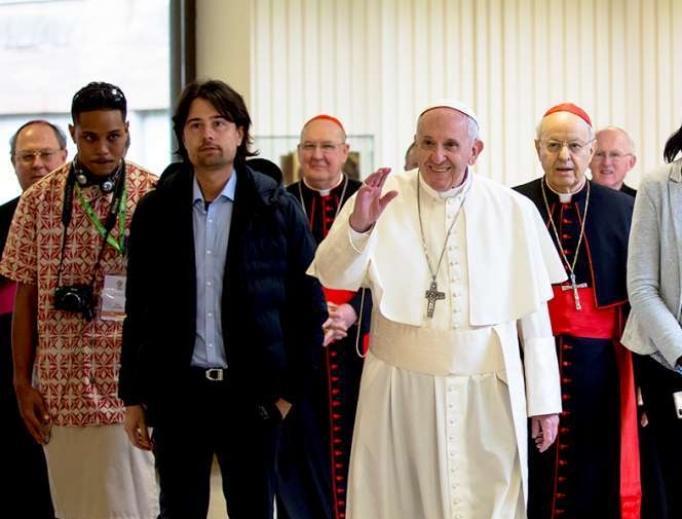 Pope Francis stands with delegates at the Vatican's pre-synodal youth meeting in March. Pope Francis stands with delegates at the Vatican's pre-synodal youth meeting in March.
