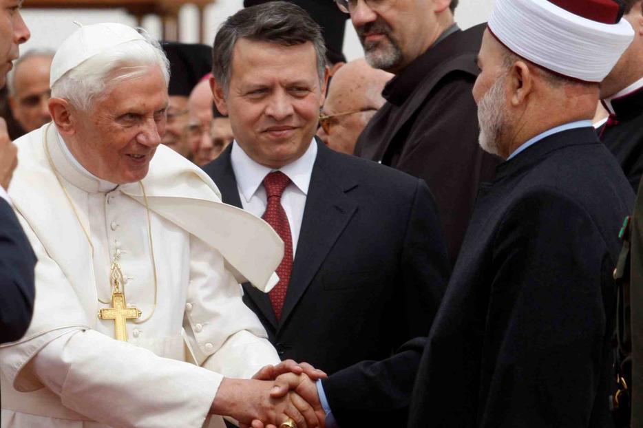 Pope Benedict XVI, standing next to Jordan's King Abdullah II, center, is greeted by a Muslim sheikh upon his arrival at Queen Alia International Airport in Amman, Jordan, May 8. Pope Benedict XVI, standing next to Jordan's King Abdullah II, center, is greeted by a Muslim sheikh upon his arrival at Queen Alia International Airport in Amman, Jordan, May 8.