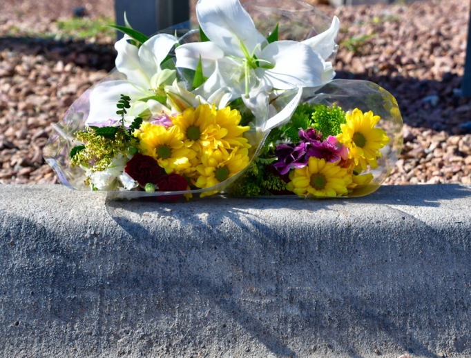 Flowers are left by an unknown person for the victims of the Walmart shooting on Aug. 3. Flowers are left by an unknown person for the victims of the Walmart shooting on Aug. 3.