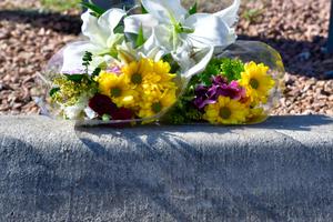 Flowers are left by an unknown person for the victims of the Walmart shooting on Aug. 3. Flowers are left by an unknown person for the victims of the Walmart shooting on Aug. 3.