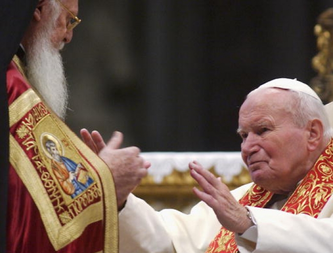 Pope John Paul II embraces Orthodox Patriarch of Constantinople Bartholomew I during an ecumenical celebration at St. Peter’s Basilica on Nov. 27, 2004, in Vatican City. The Pope also returned relics of two early Christian saints, aiming to establish unity among the two Christian churches. Pope John Paul II embraces Orthodox Patriarch of Constantinople Bartholomew I during an ecumenical celebration at St. Peter’s Basilica on Nov. 27, 2004, in Vatican City. The Pope also returned relics of two early Christian saints, aiming to establish unity among the two Christian churches.