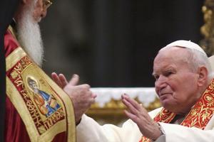 Pope John Paul II embraces Orthodox Patriarch of Constantinople Bartholomew I during an ecumenical celebration at St. Peter’s Basilica on Nov. 27, 2004, in Vatican City. The Pope also returned relics of two early Christian saints, aiming to establish unity among the two Christian churches. Pope John Paul II embraces Orthodox Patriarch of Constantinople Bartholomew I during an ecumenical celebration at St. Peter’s Basilica on Nov. 27, 2004, in Vatican City. The Pope also returned relics of two early Christian saints, aiming to establish unity among the two Christian churches.