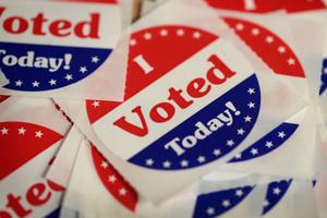 Stickers are made available to voters who cast a ballot in the midterm elections at the Polk County Election Office Oct. 8 in Des Moines, Iowa. Oct. 8 was the first day of early voting in the state. Stickers are made available to voters who cast a ballot in the midterm elections at the Polk County Election Office Oct. 8 in Des Moines, Iowa. Oct. 8 was the first day of early voting in the state.