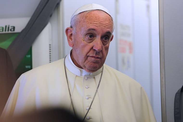 Pope Francis speaks aboard a flight from Italy to Ecuador July 5, 2015. Pope Francis speaks aboard a flight from Italy to Ecuador July 5, 2015.