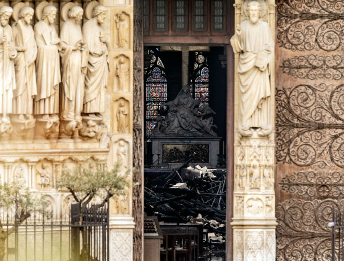 The interior of Notre Dame Cathedral, which suffered a devastating fire April 15, is seen through a doorway April 16. The interior of Notre Dame Cathedral, which suffered a devastating fire April 15, is seen through a doorway April 16.